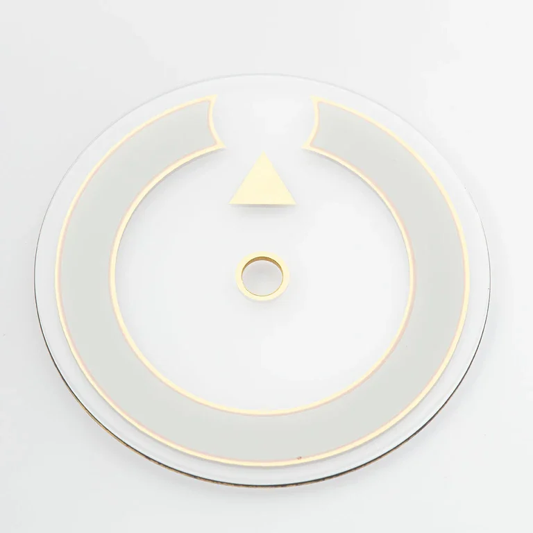 Disque transparent aux filets dorés avec repère triangulaire