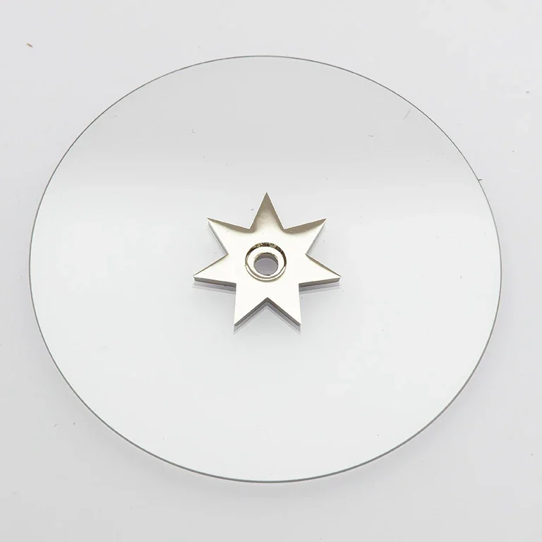 Disque indicateur transparent avec étoile métallique et noyau collé